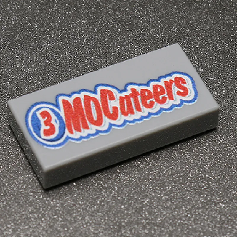 B3 Customs | Custom Parts>The Brick Show Shop 3 MOCateers - Custom Printed 1x2 Tile made using LEGO part
